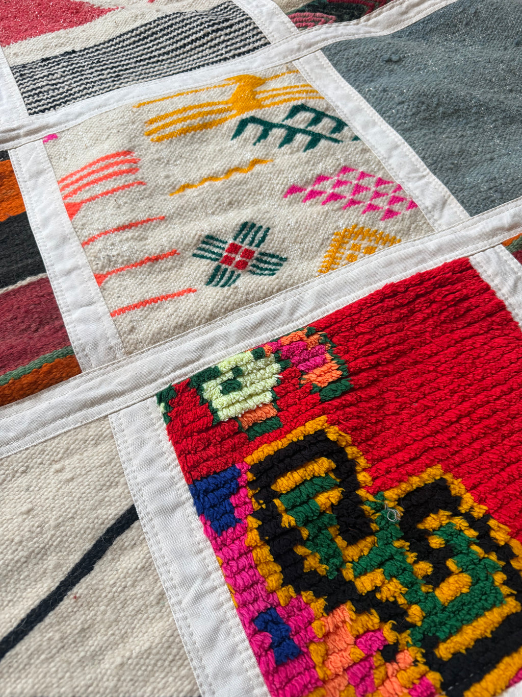 Close-up of handwoven wool patchwork wall art from Morocco, 234cm x 142cm
