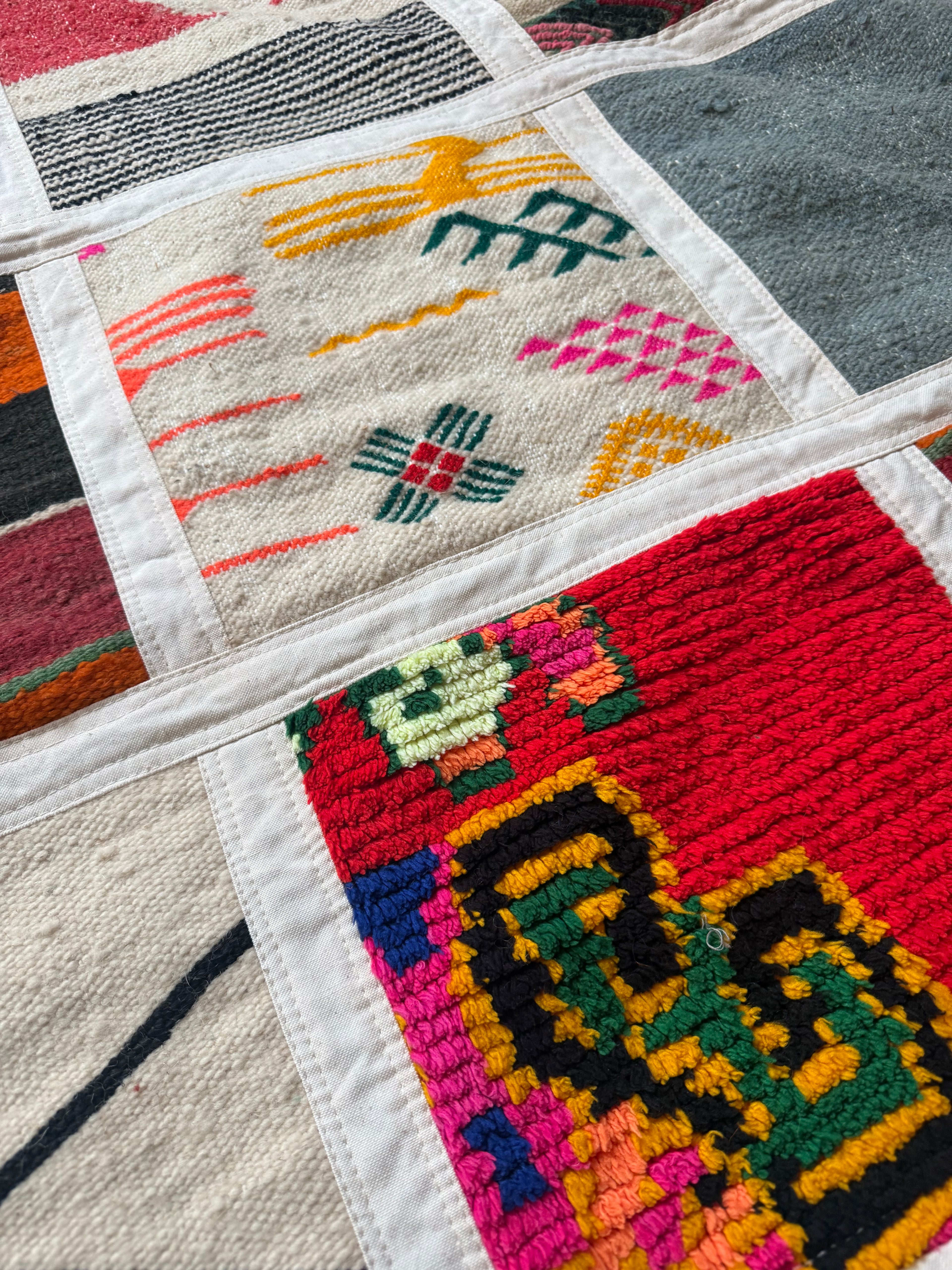 Close-up of handwoven wool patchwork wall art from Morocco, 234cm x 142cm