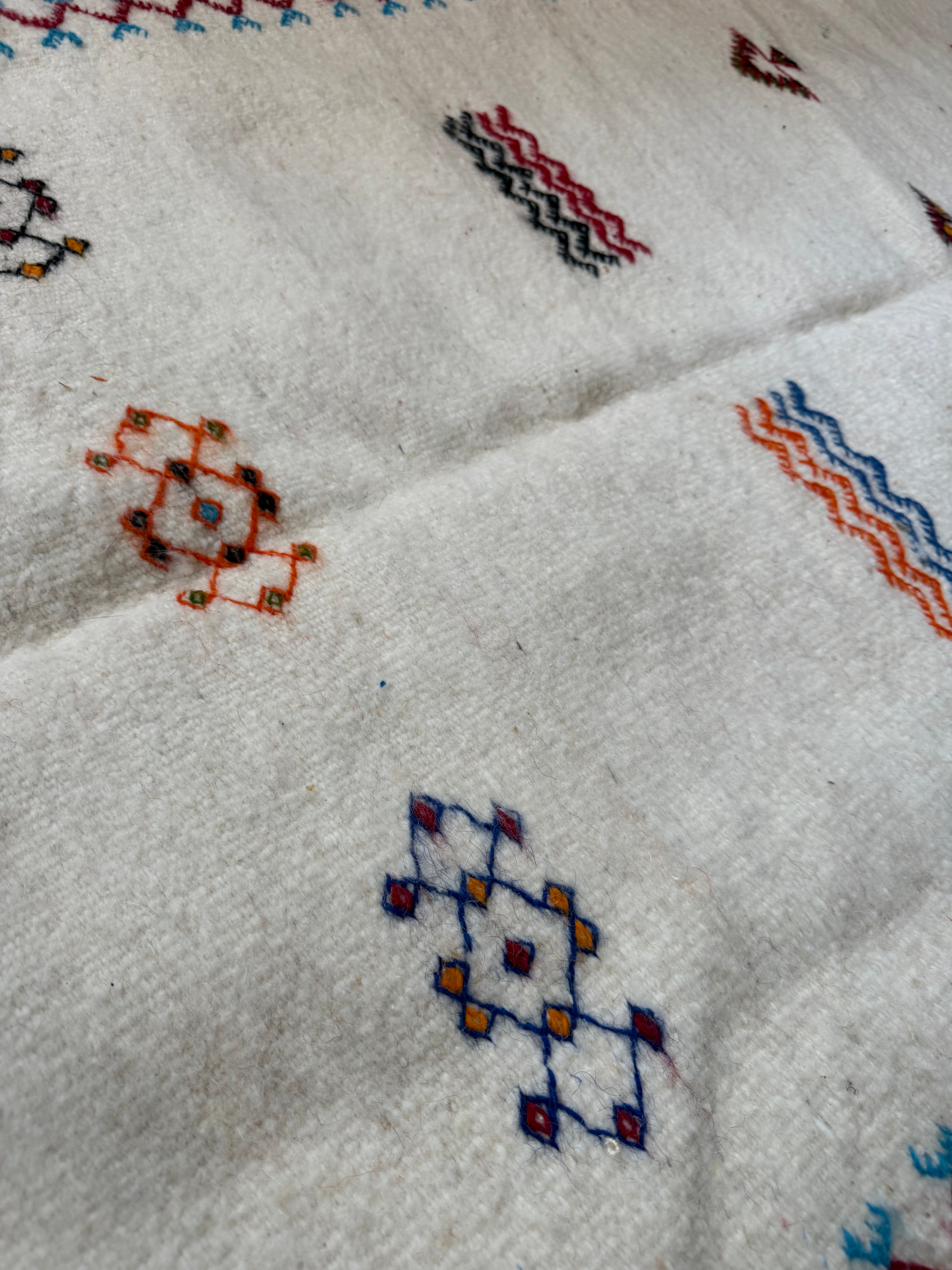 Dawn Moroccan runner close-up showing handwoven wool texture and Berber symbol motifs