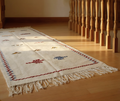 Dawn cream Moroccan hallway runner with scattered red and blue Berber motifs - long tasselled ends, natural wool, Lemon Drops Fresh Finds