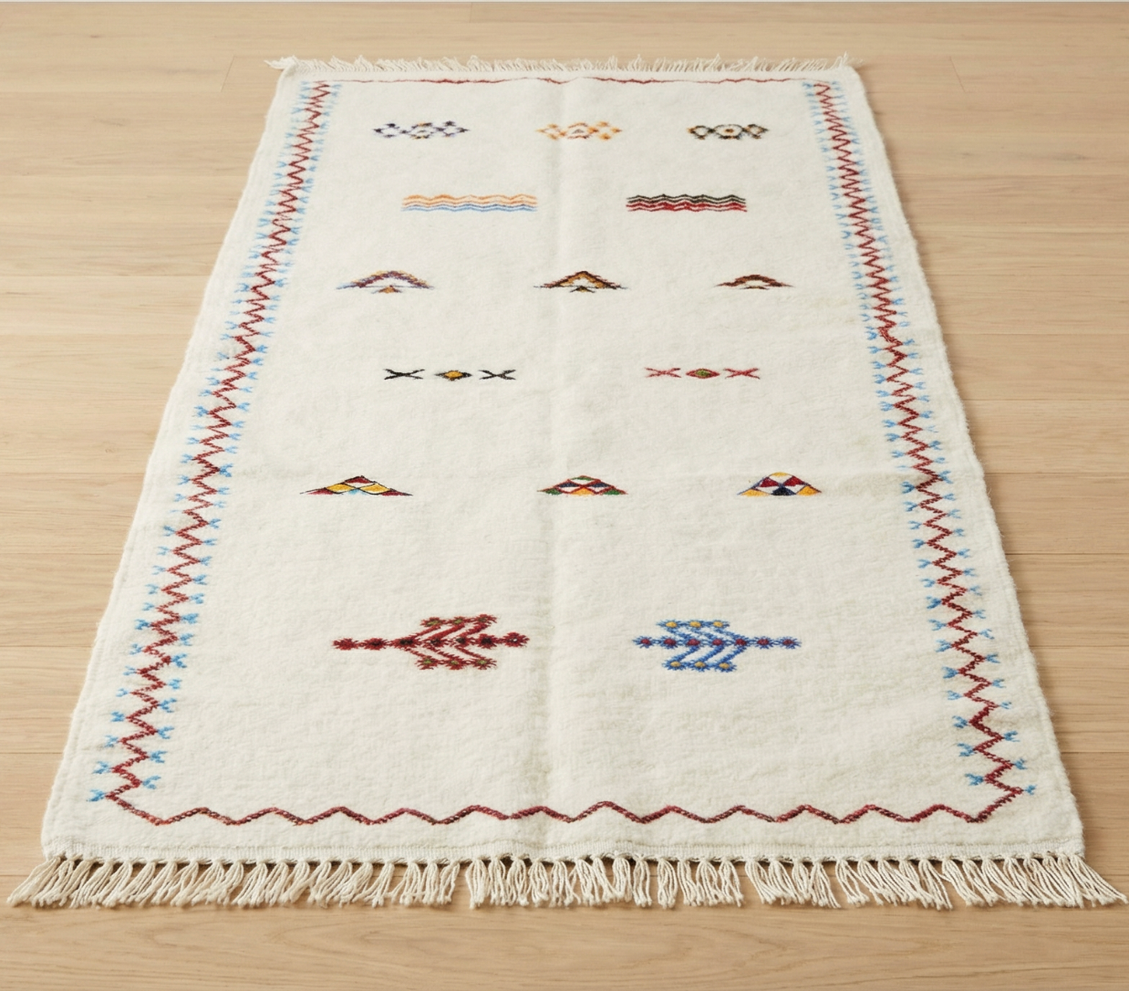 Dawn runner rug product photo - cream ground with sparse geometric markings and fringe