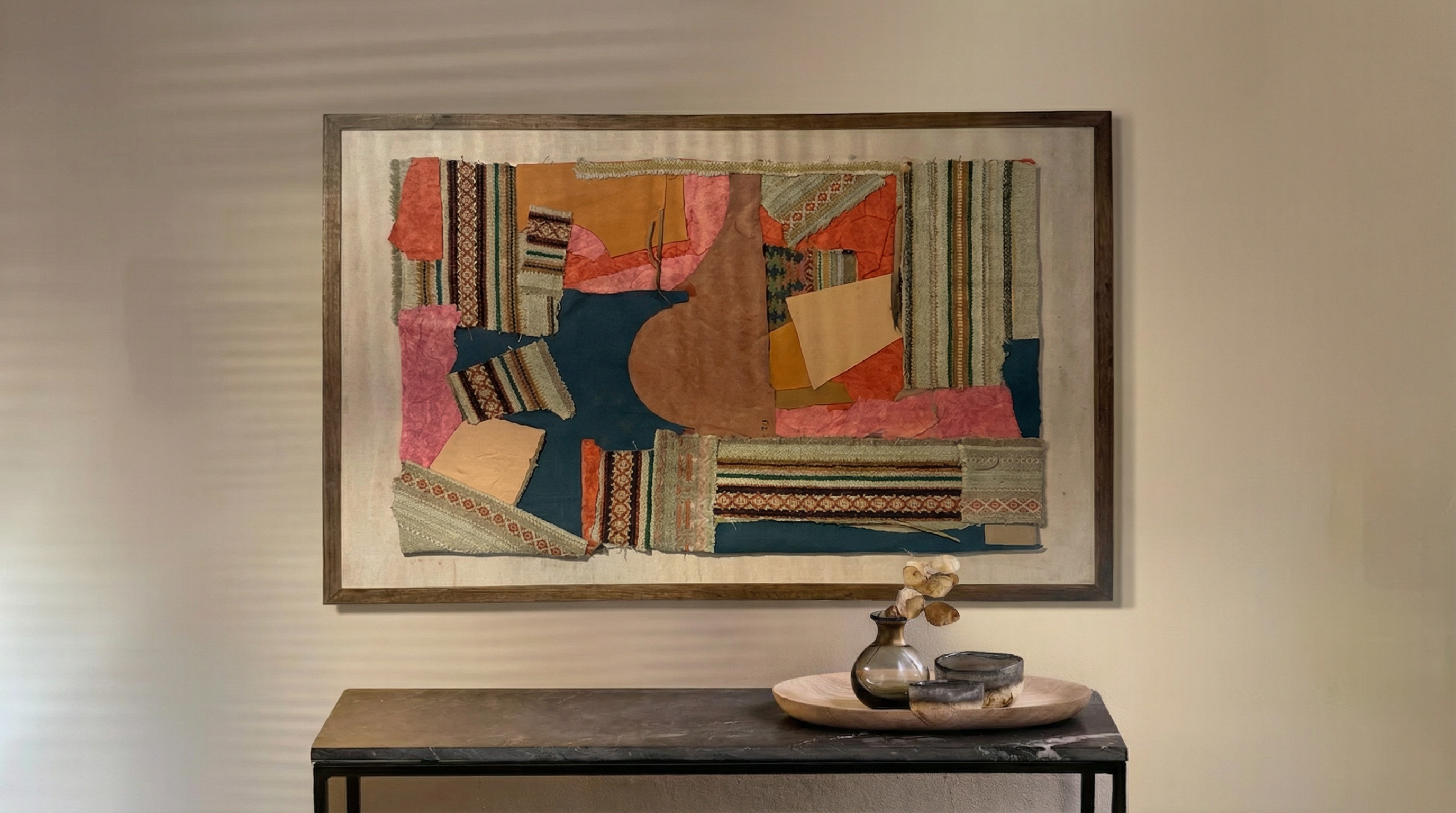 No.11 artwork in warm interior setting - large framed textile patchwork with geometric and abstract fabric panels